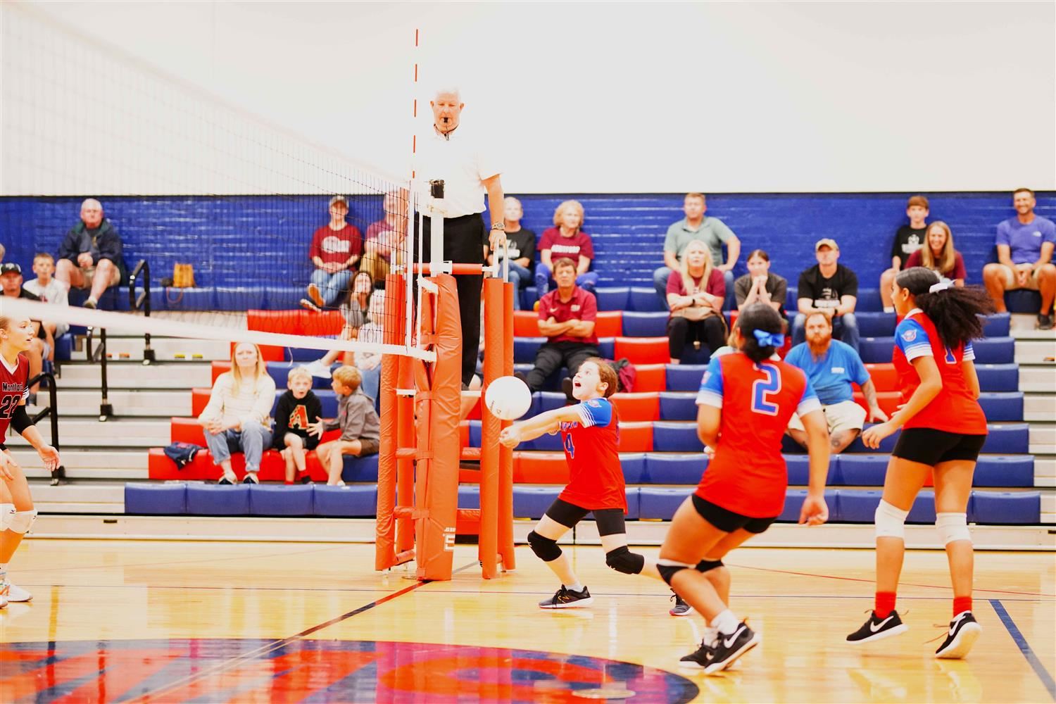 Fiona bumps the ball sending it over the net to the other team